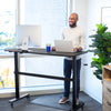 black | black-shelf | Go from sitting to standing in seconds with the Tranzendesk standing desk by Stand Steady.
