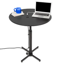 The Height-Adjustable Round Table with Built-In Charging by Stand Steady.