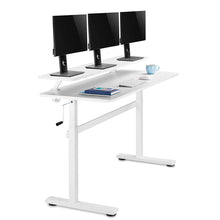 white | white-shelf | Float of the Tranzendesk Standing Desk with shelf with three monitors on it.