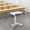 White | Lifestyle image of the Cruizer mobile podium and lectern by Stand Steady in a lecture hall.