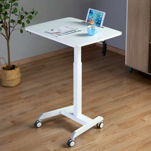 Lifestyle image of the Cruizer crank mobile podium by Stand Steady in a home office setting.