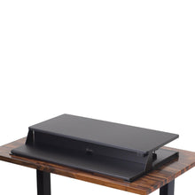 black | 36-inch-desktop | Black 36" electric desk converter in tallest height setting with no props.