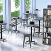 Lifestyle image of the Stand Steady mobile table in a library setting. 