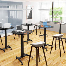 Lifestyle image of the Stand Steady height adjustable round table in a classroom setting.