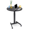 The Stand Steady height adjustable round table and mobile workstation with props on it.