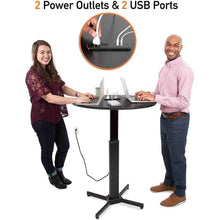 The Stand Steady Round Charging Table can easily go from a sitting to standing desk in seconds! The power outlets in the middle let you keep your phones, laptops, and tablets charged while you work!
