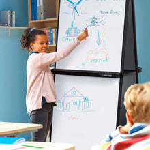 Lifestyle image of the Stand Steady double-sided mobile whiteboard with a child writing on it.