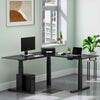 Lifestyle image of the Tranzendesk l shape standing desk in an office setting.