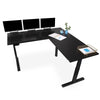 Black | without-shelf | The Tranzendesk electric l-shaped standing desk with props on it.