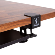 The Stand Steady under desk shelf securely clamps to your workspace.