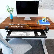 This premium under desk keyboard tray by Stand Steady is designed with a sleek metal frame and a pressed wood print tray.