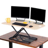 Maple | The X-Elite Premier corner desk converter in maple can take your desk from sitting to standing in seconds.