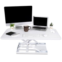 White | This spacious white desktop has plenty of room for all of your wrokplace necessities including multiple monitors, a laptop, keyboard, and more.