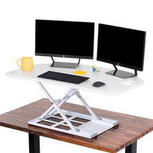 White | The X-Elite Premier corner desk converter in white can take your desk from sitting to standing in seconds.