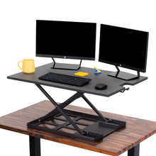 The X-Elite Pro 36 inch desk converter can take your desk from sitting to standing in seconds.